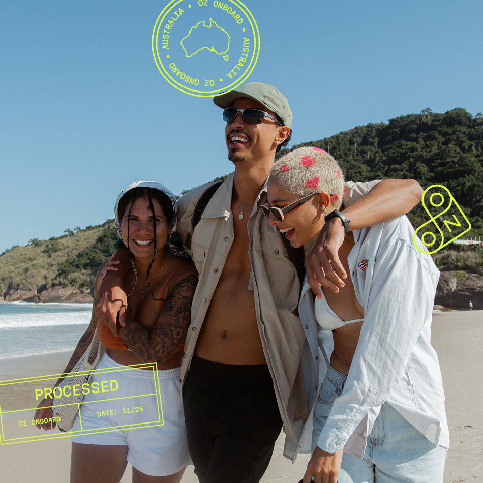 Three friends laughing and walking along a sandy beach, embodying the connection of a personalised property marketing campaign adapting in real-time.