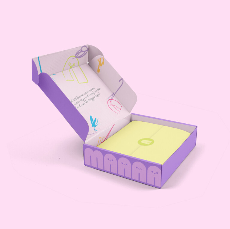 An open purple box with whimsical line drawings on the interior flap and yellow tissue paper secured with a branded sticker for a personalised property marketing campaign.